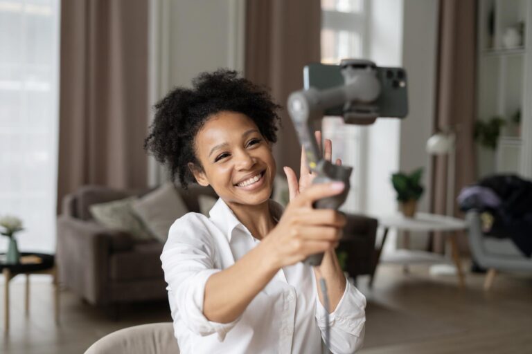 vlogger taking selfie video with phone as part of her influencer marketing strategy
